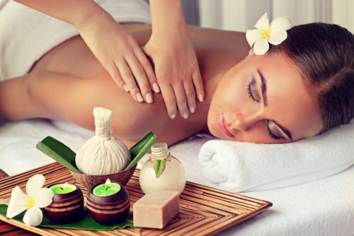 Body care. Spa body massage treatment. Woman having massage in t